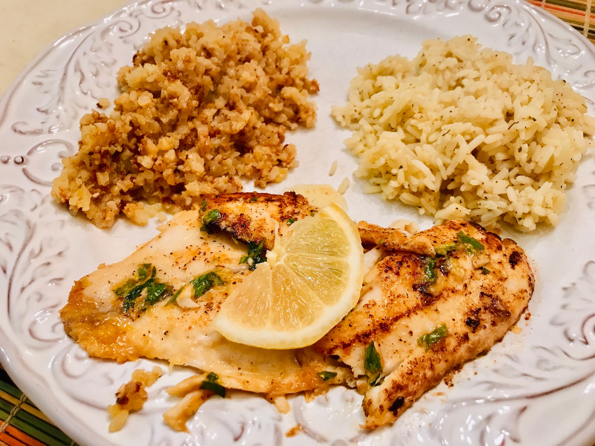 Freshly cooked, mouth watering, oven baked Lemon Tilapia with garlic and herbs
